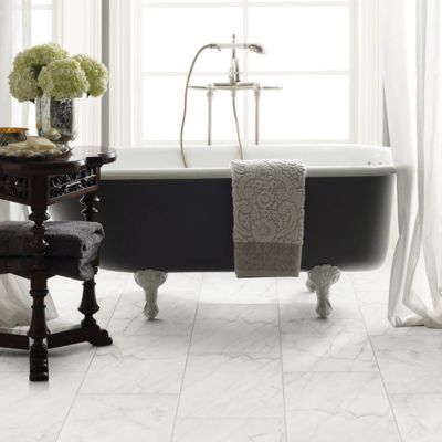 marble look tile floors in a bright elegant bathroom